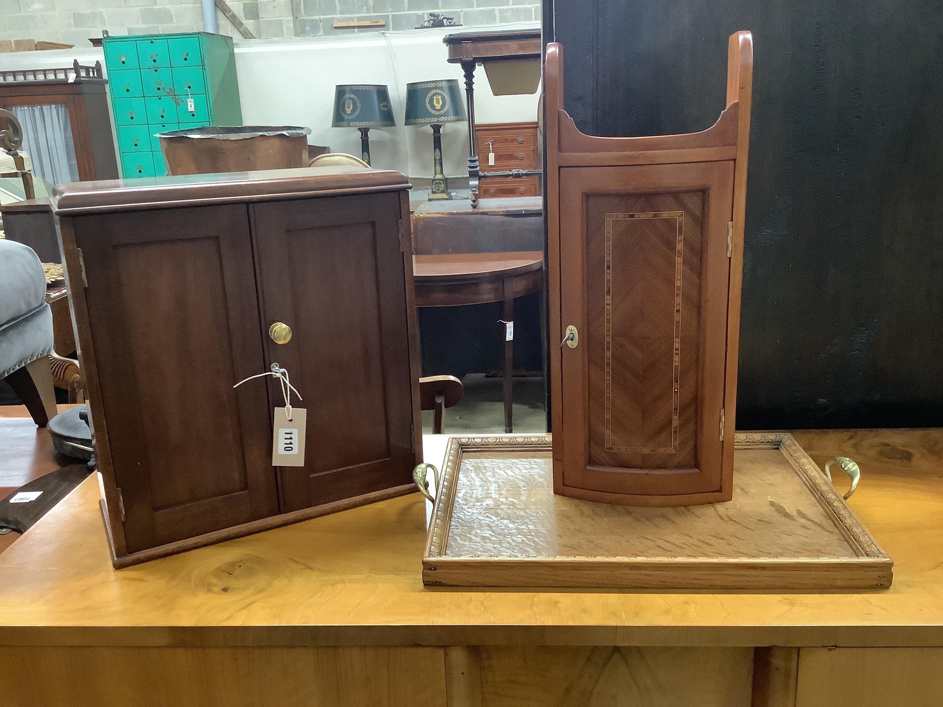 A small Victorian two door cabinet, width 37cm, depth 18cm, height 40cm, an Edwardian style wall cabinet and a brass handled oak tea tray